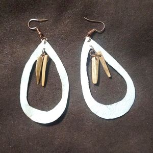 Earrings with bone dangle in the center